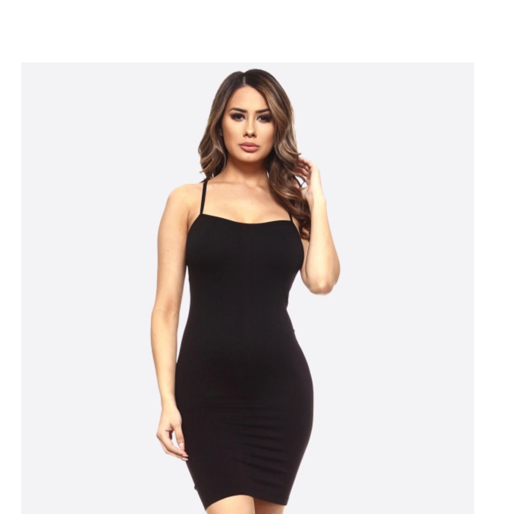Stunning little black dress Hugs those beautiful..